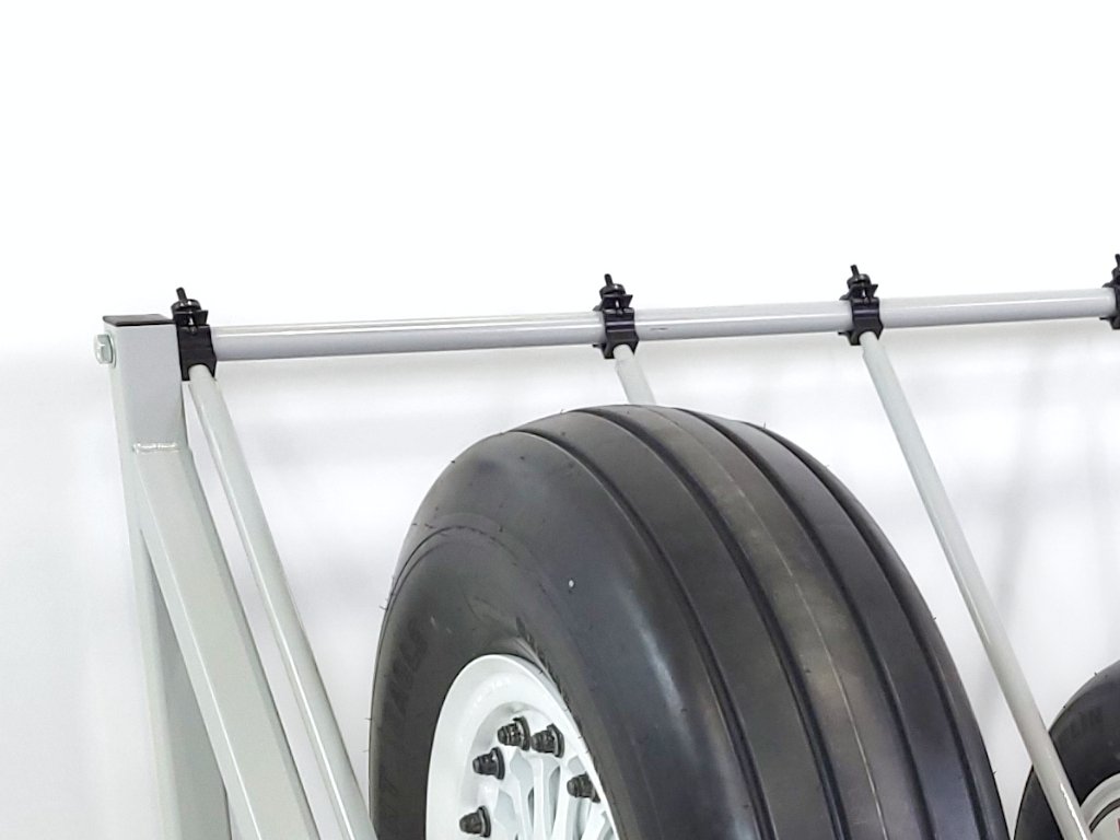 Adjustment rack system for multiple-sized aircraft wheels and tires.